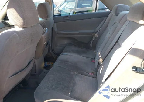 2003 Toyota Camry Le z USA, uszkodzony, nr VIN JTDBE32KX30233253